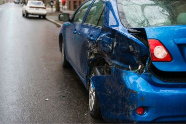blue car with damages from an accident