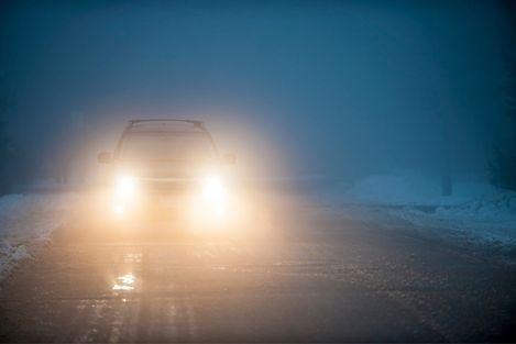 Cars Driving On Highway In Fog