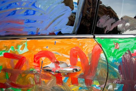 car vandalized by colourful paint