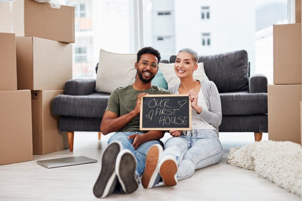 First time home buyers sitting inside house