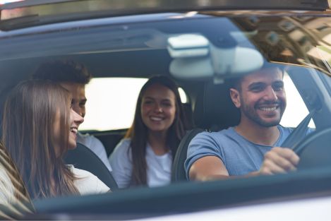 group of people driving a car together