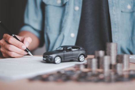 man filling out car insurance application