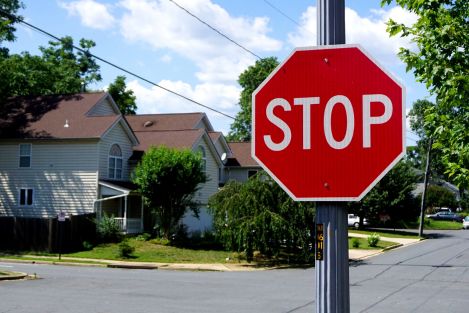 a stop sign in a suburb